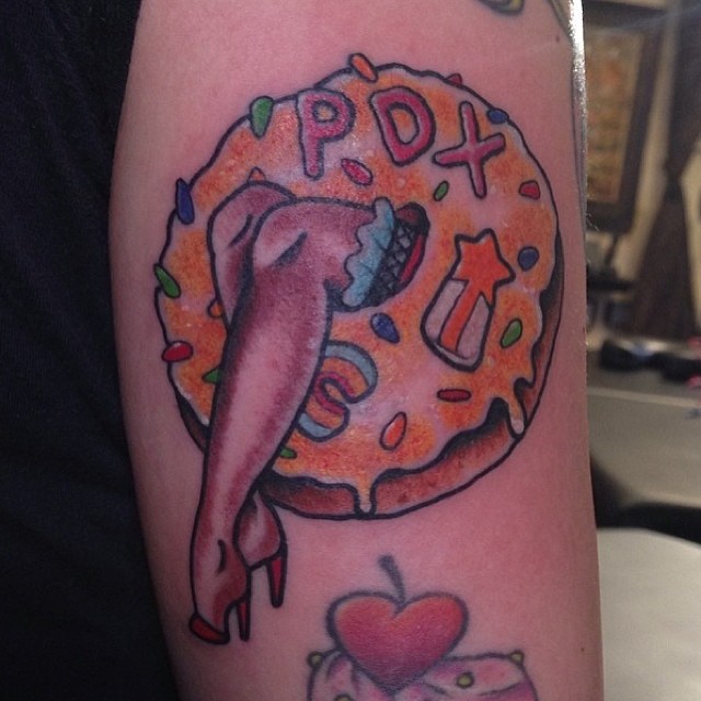 Portland in a doughnut-hole tattoo by Ross Carlson